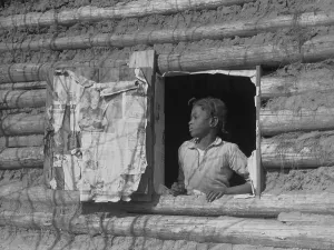 Log Cabin Prints: African American girl looking out the window of a plantation log cabin tenants home