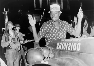 Disorder Prints: African American man with arms raised in the riot-torn Hough Avenue section of Cleveland