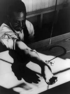 Patient Prints: African American man receiving intravenous treatment for venereal disease