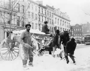 Images Dated 18th December 2007: African American men loading snow onto wagon