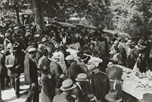 Automobiles Prints: African American men and women gathered around a picnic table