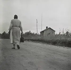 At Home Prints: African American Midwife carrying her medical bag on a dirt road in Georgia