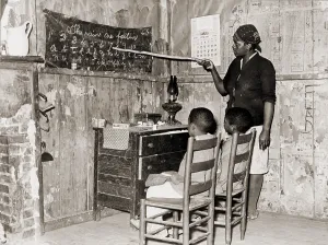 Louisiana Prints: African American mother teaching children numbers and alphabet in their sharecropper home in Transylvania
