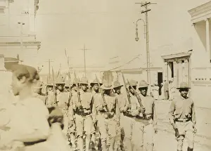 Parade Prints: African American soldiers marching down street carrying Springfield rifles