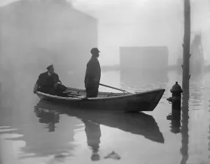 Workers Prints: An African American steers a boat through Georgetown
