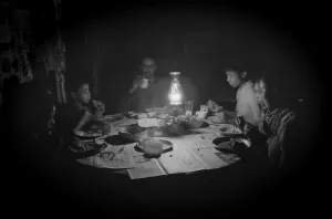 Bread Prints: African American tenant farming family dining by kerosene lantern light