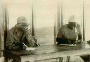 Communes Prints: Two African American women in an adult education in class