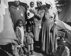 Charity Prints: African American women with three children during the 1927 Mississippi River flood
