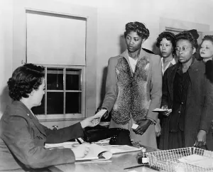 Volunteers Prints: African American women presenting papers to a WAC