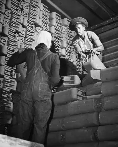 Overalls Prints: African American women stacking five-gallon gasoline cans at Savannah Quartermaster Depot