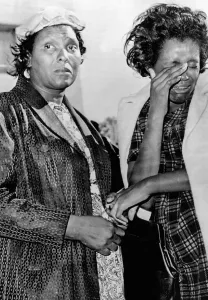Dallas Prints: Two African American women stand outside Parkland Hospital in Dallas