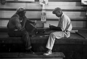 Louisiana Prints: African American young men play a card game of Coon Can