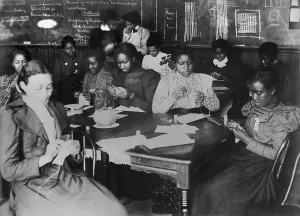 Teacher Prints: African American young women in sewing class at Haines Normal and Industrial Institute