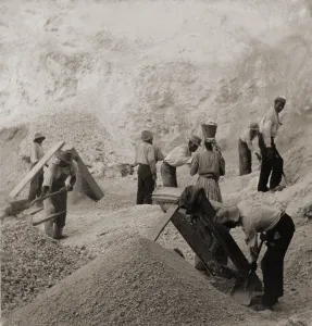 Mining Prints: Afro-Caribbean laborers, including one woman, in the stone quarries, Jamaica in 1900