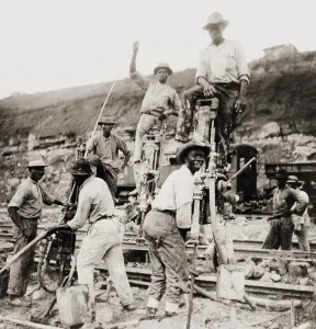 Panama Prints: Afro-Panamanian construction workers boring through rock with tripod drills during the construction of the Upper