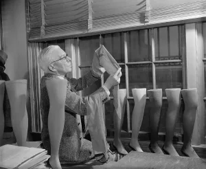Sheer Prints: Agriculture Department fabric technician examines the cotton stockings that would replace those made by Japanese silk