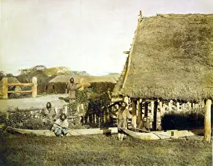 Canoe Prints: Four Ainu men with two boats, by a thatched roof building on the island Hokkiado