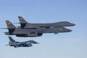 Maneuvers Prints: Two US Air Force B-1B Lancers fly with a Japanese air force F-15 fighter jet