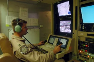 Remote Control Prints: An Air Force officer maneuvers an unmanned Predator reconnaissance airplane over Iraq by remote control at Balad Air