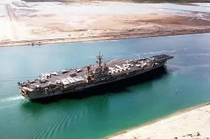 Aircraft carrier JOHN F. KENNEDY in the Suez Canal traveling home to Norfolk Virginia after a seven month deployment during the First Iraq War. 1991. Mar. 1 1991