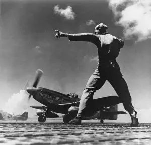 Bombers Prints: Airman gives the take off signal to North American P-51 nicknamed My Girl on Iwo Jima