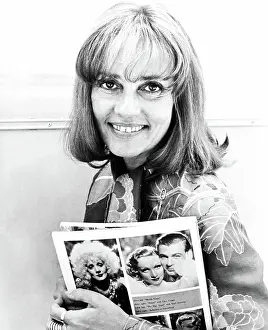 Jsx 48 Prints: ALEX IN WONDERLAND, Jeanne Moreau (holding photos of Marlene Dietrich and Gary Cooper in BLONDE VENUS and DESIRE)