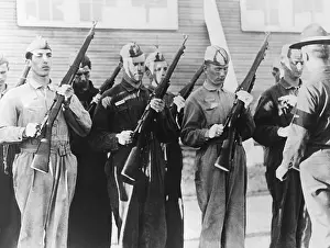 Sergeant Prints: Alexis F. DuPont II in the (center with arrow) at inspection arms in the air corps basic training