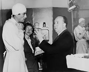 Lcgr1501 Prints: Alfred Hitchcock discusses scene in Spellbound with Gregory Peck and script clerk Adele Cannon - (BSLOC_2014_17_81)