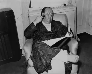 Bathrobe Prints: Alfred Hitchcock, seated in a recliner