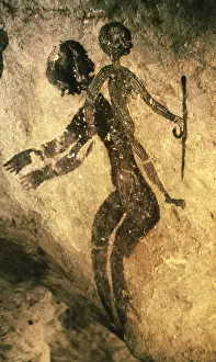 ALGERIA. Tassili N'Ajjer. Depicting people from the age of the round-heads (circa 4000-1500 BC). Neolithic art. Cave