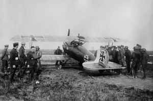 Fighters Prints: Allied soldiers gather around a captured WW1 German Albatross fighter. 1916-18