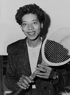 Althea Prints: Althea Gibson, holding tennis racquet, in New York City, 1956