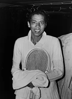 Tennis Prints: Althea Gibson, takes refuge from rain while playing tennis at Forest Hills in 1950