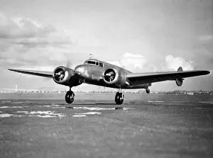 Images Dated 17th March 2007: Amelia Earhart does a last minute checkup of fyling instruments before her take off from Alamdea