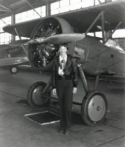 Flyers Prints: Amelia Earhart standing next to an airplane, July 30, 1936. (BSLOC_2013_8_214)