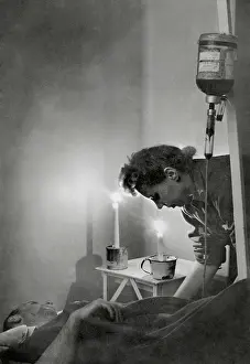 Spiritual Prints: American Army nurse at candle lit bedside of wounded soldier in France during World War 2