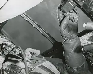 Bombers Prints: American Bombardier with his hand on the Bomb Release over Germany in 1943