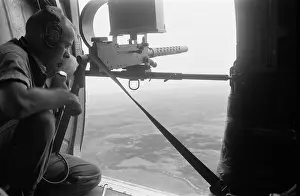 Lcgr1511 Prints: American door gunner scans the Vietnamese landscape from a helicopter