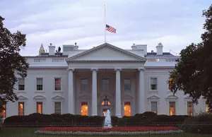 Guards Prints: American flag flies at half-staff over the White House at sunrise Friday, Sept. 14, 2001