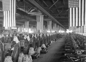 Patriotism Prints: American flags decorate the machine shop for 3 inch artillery shells at the Bethlehem Steel Company during World War I