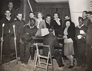 Crutches Prints: American GIs are entertained by pianist Horatio Davies