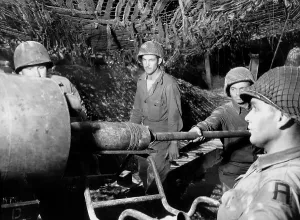 Explosives Prints: American gunners load a shell into the barrel of a gun M1 155mm Long Tom in France
