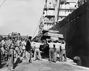 Trucks Prints: American-made truck lowered from a freighter at Piraeus as part of a relief effort to Greece
