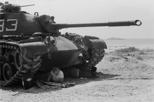 Observation Prints: American soldiers reads in the shade under a US Marine tank in Beirut, Lebanon