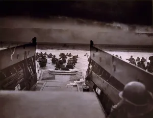 English Channel Prints: American soldiers wade from Coast Guard landing craft toward the Omaha Beach against machine gun fire on D-Day