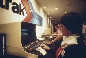 2011 Prints: An AMTRAK worker at a computer terminal gets information on available space and fares and can enter reservations