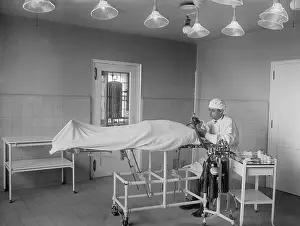 Patient Prints: Anesthesiologist administers ether and nitrous oxide to patient before surgery in operating room