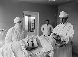 Patient Prints: Anesthesiologist and surgical nurse with a post-operative patient