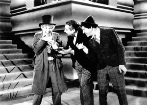 Chico Prints: ANIMAL CRACKERS, from left: Harpo Marx, Louis Sorin, Chico Marx, 1930