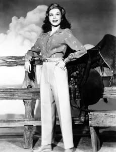Print Blouse Prints: Ann Miller wearing slacks and print blouse, ca. 1940s